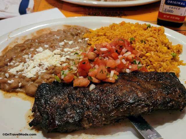 skirt steak with rice and refried beans